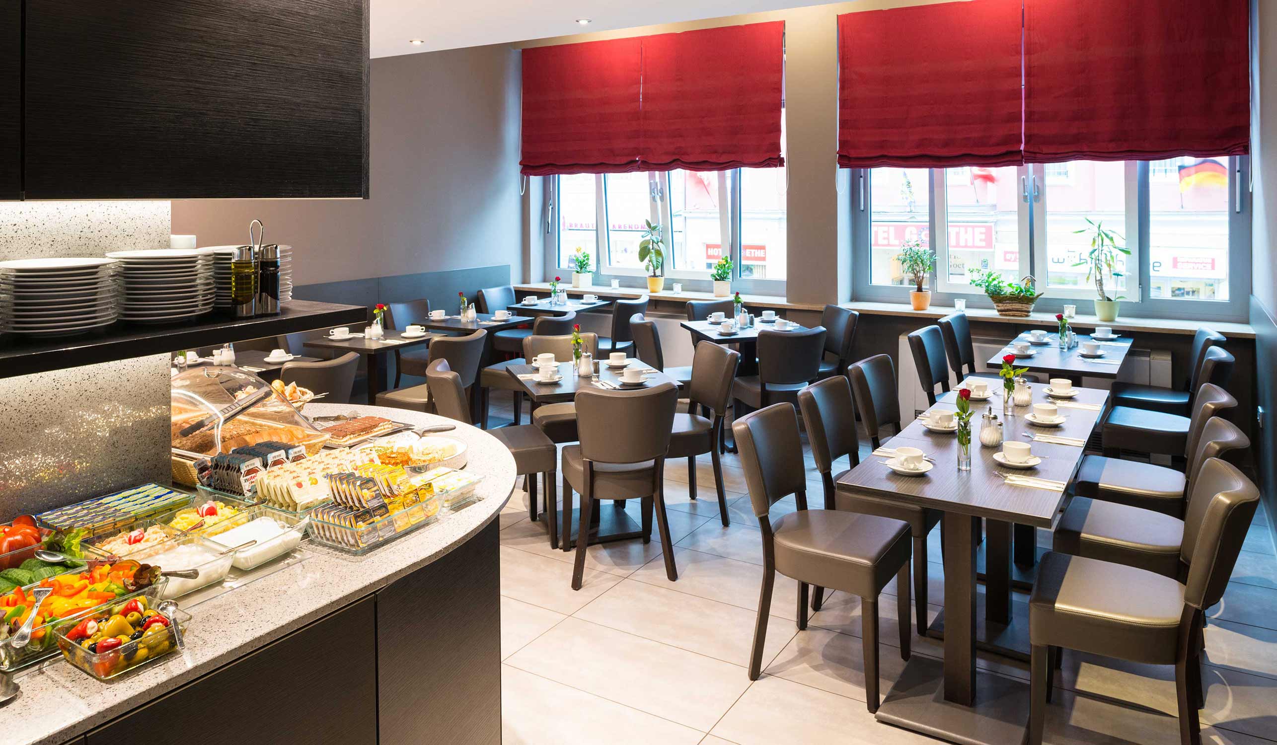 Munich Inn Design Hotel impressione della sala colazione